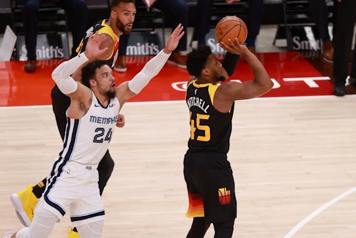 Donovan Mitchell (45) hits a three pointer in front of Dillon Brooks (24)
